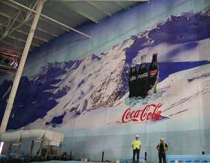 A 3,500sq.m. graphic featuring an Alpine scene for an indoor snow and ski slope.
