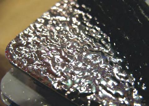 Dibond Stucco shown close up under lighting.