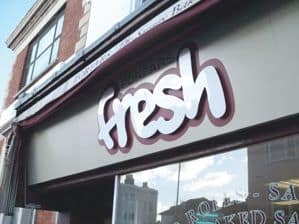 The Fresh Logo above the shop