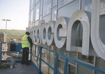 LED illuminated individual letters on the side of a building.