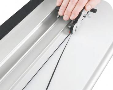 Textile cutter cutting thin fabric.