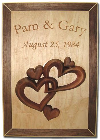 Dimensional sign with 3D hearts and inlayed text.