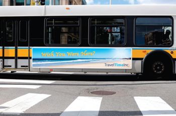 Bus with a sign on the side.