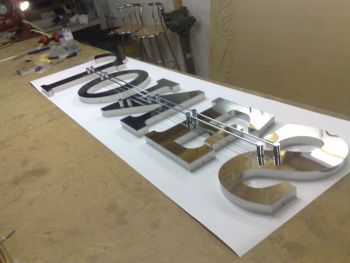 Built up s/steel letters with fitted Gdi Trax rod connections.