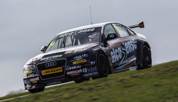 A finished wrapped touring car on the track.