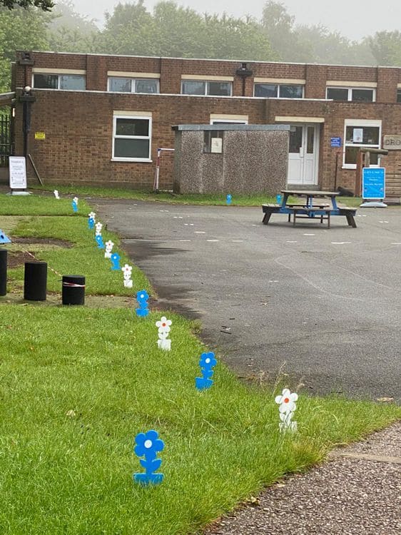 Flower markers, laser cut from acrylic on their Mercury 3 Laser Pro