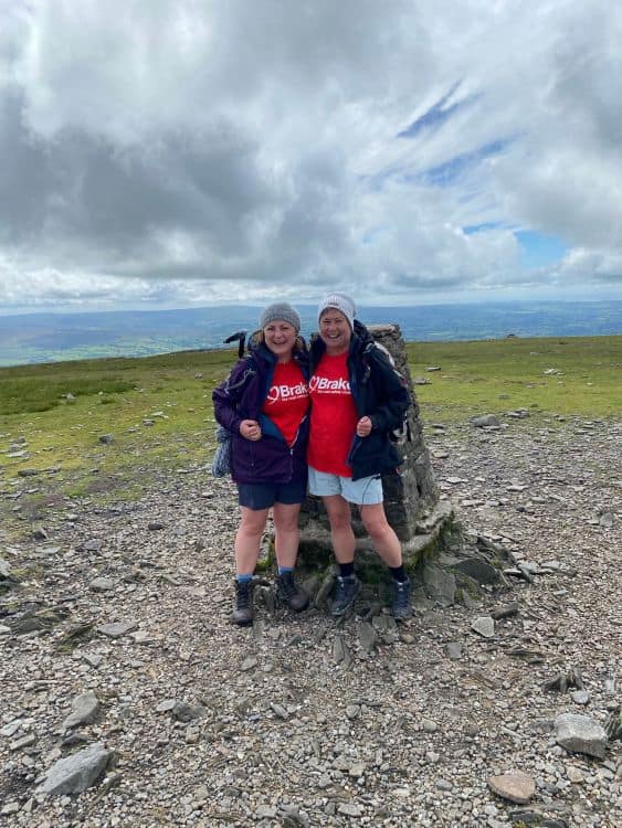 Two ladies walking up Ingleborough