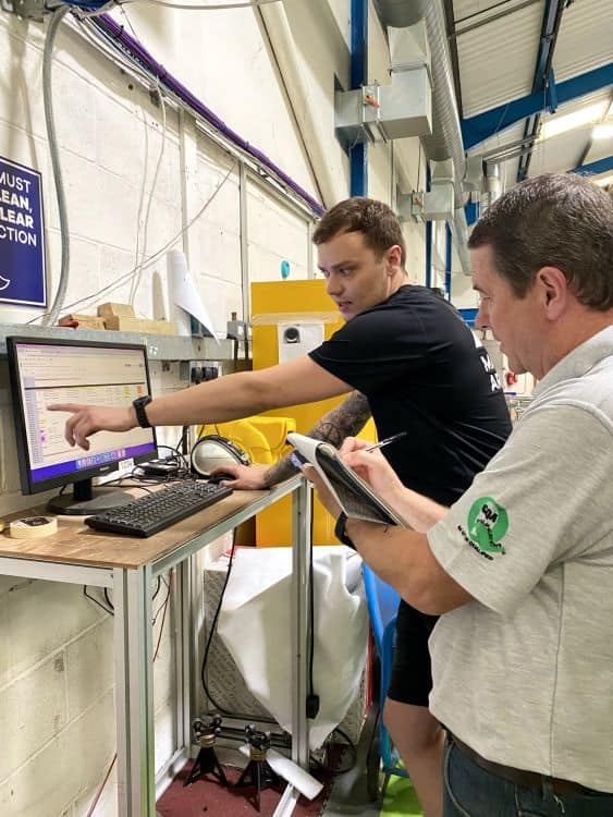 Two men working in workshop