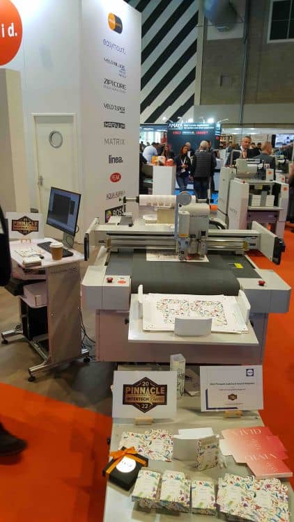 Lamination machine in action at an exhibition