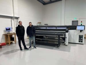 Dayfolds large format team L R Ryan Poulson and Mazin Nabulsi alongside HP Latex R2000 printer Dayfold Group brings large-format printing in house with new HP Latex printer