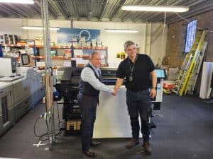 Barry Page from DCS shakes hands with Martin Williams from Papergraphics installation and training team DCS eyes sustainable expansion with UK’s first HP Latex R530 printer