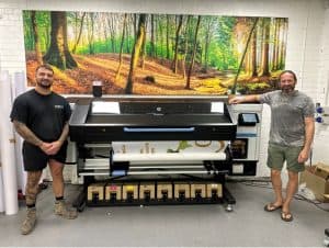 Sam Pratt, print manager, and Nathan Swinson-Bullough, managing director, alongside the new HP Latex 830W printer